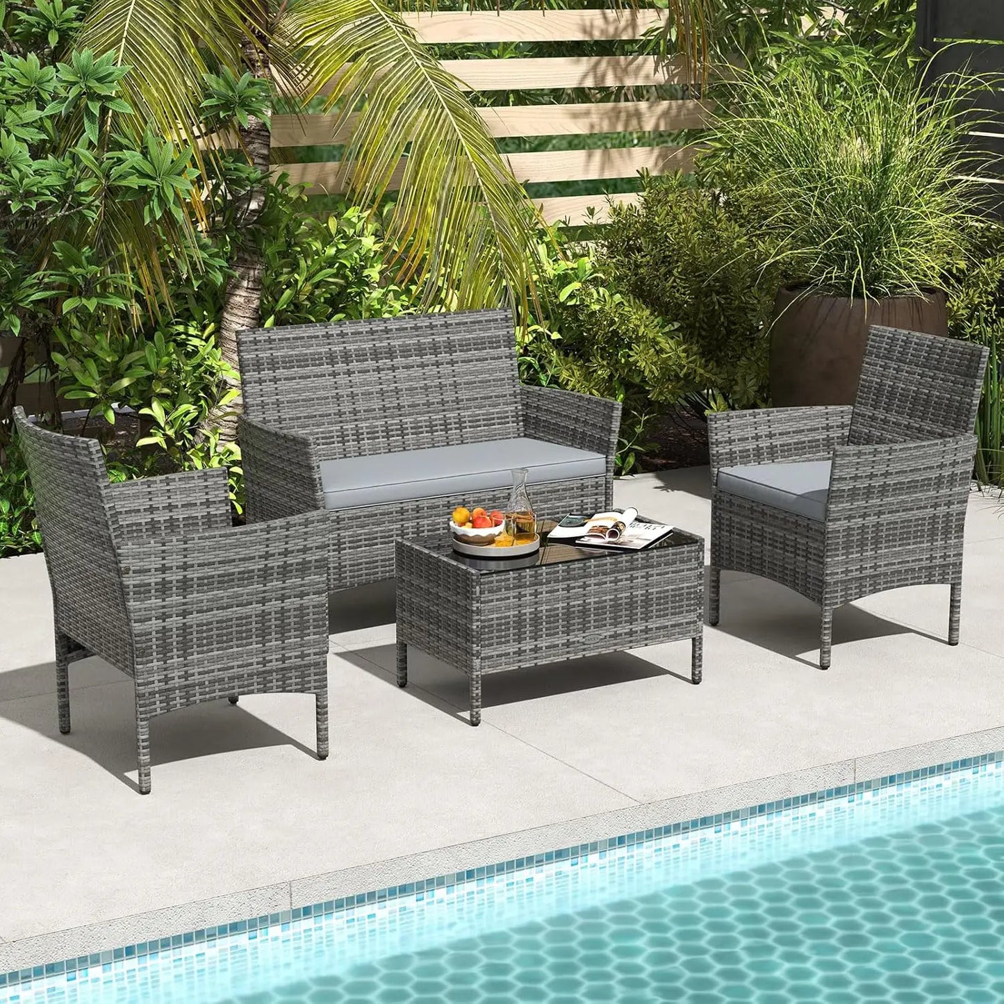 Rattan Outdoor 4-Piece Patio Set With Cushions And Glass Coffee Table
